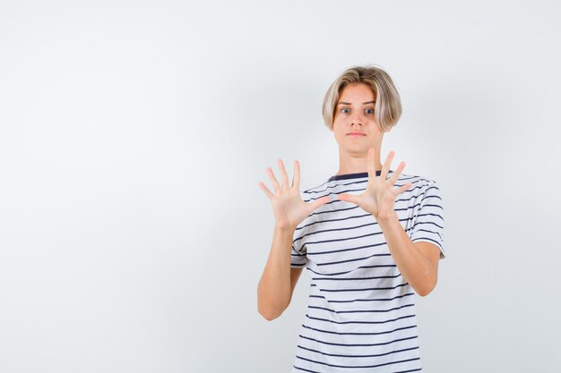 Handsome teen boy in a striped t-shirt