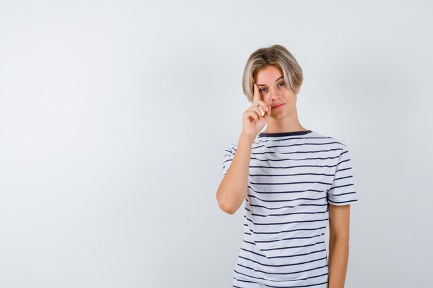 Handsome teen boy in a striped t-shirt