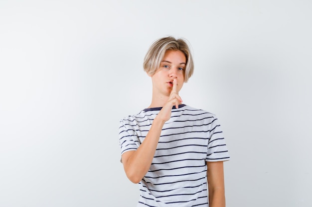 Handsome teen boy in a striped t-shirt