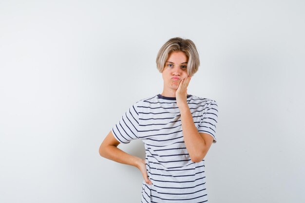 Handsome teen boy in a striped t-shirt