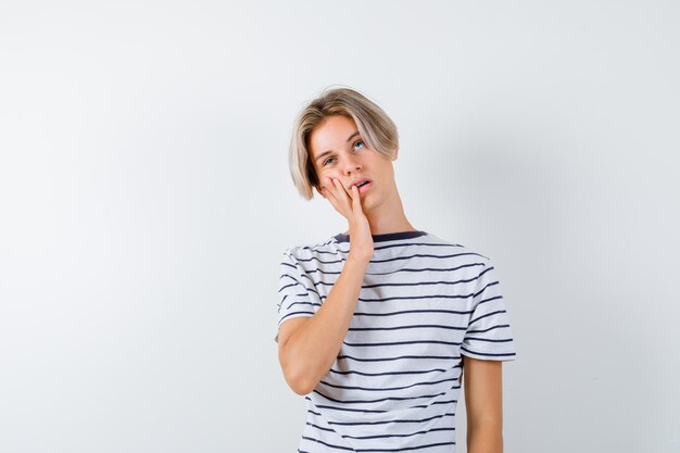 Handsome teen boy in a striped t-shirt