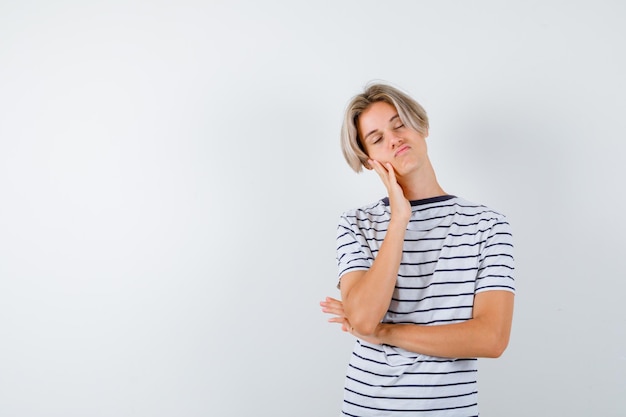 Handsome teen boy in a striped t-shirt