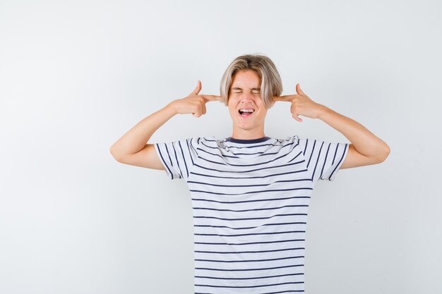 Handsome teen boy in a striped t-shirt