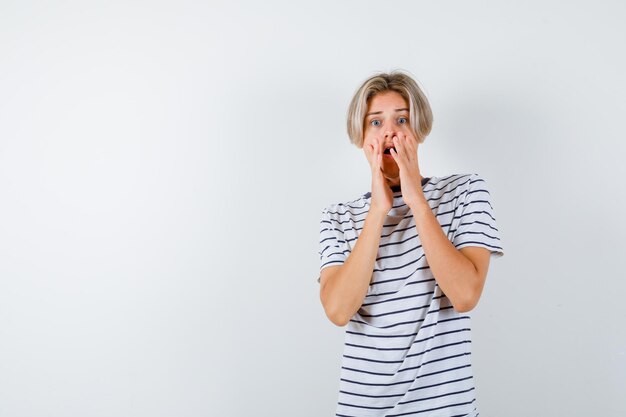 Handsome teen boy in a striped t-shirt