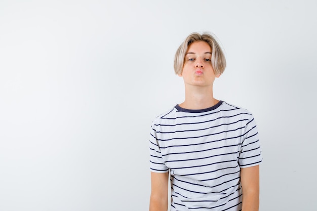 Handsome teen boy in a striped t-shirt