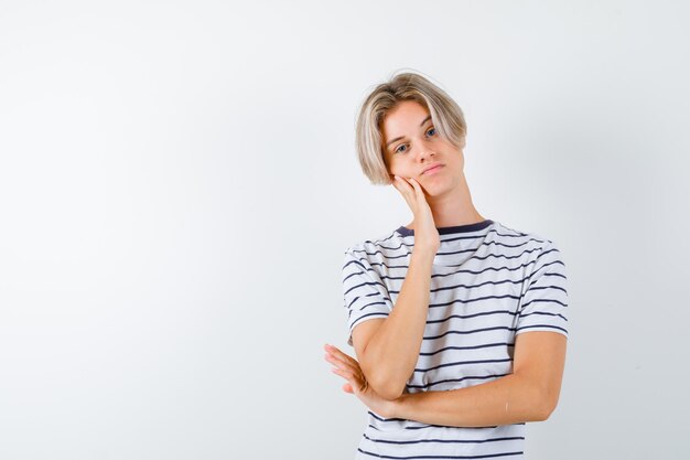 Handsome teen boy in a striped t-shirt