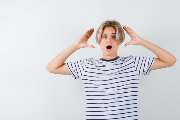 Handsome teen boy in a striped t-shirt