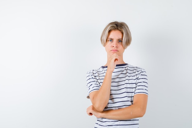 Free photo handsome teen boy in a striped t-shirt