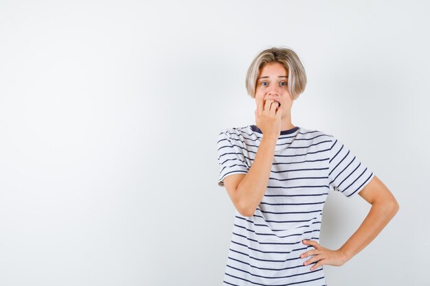 Handsome teen boy in a striped t-shirt