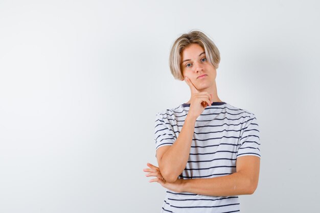 Handsome teen boy in a striped t-shirt