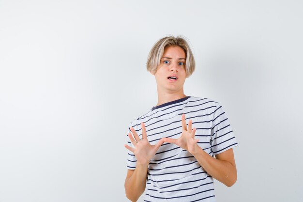 Handsome teen boy in a striped t-shirt