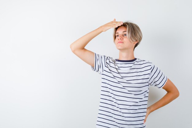 Handsome teen boy in a striped t-shirt