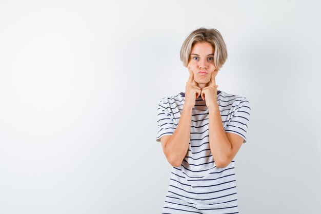 Handsome teen boy in a striped t-shirt