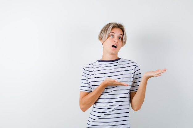 Handsome teen boy in a striped t-shirt