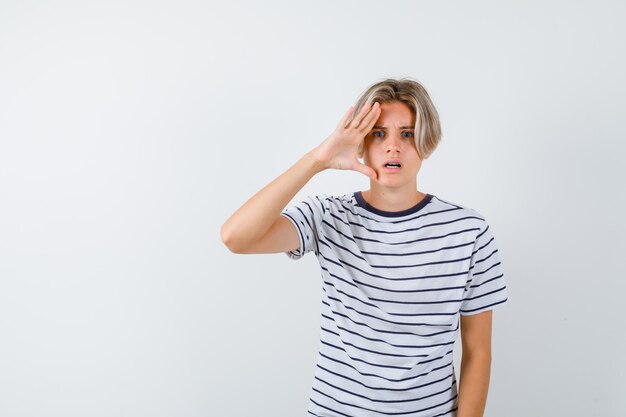 Handsome teen boy in a striped t-shirt