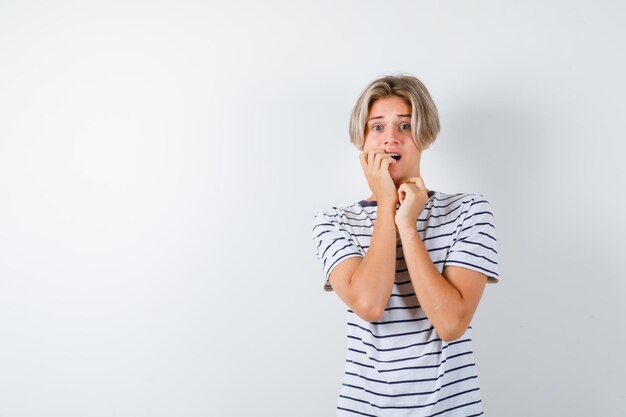 Handsome teen boy in a striped t-shirt