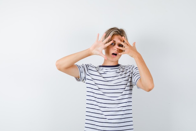 Handsome teen boy in a striped t-shirt