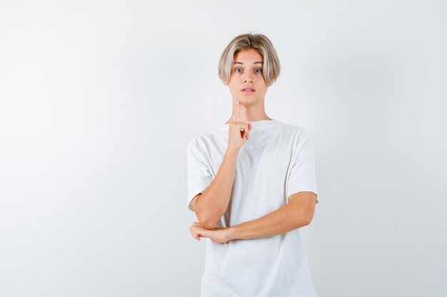 Handsome teen boy in a white t-shirt