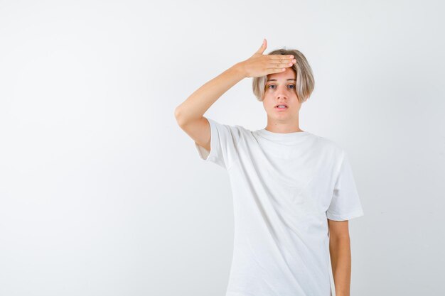 Handsome teen boy in a white t-shirt