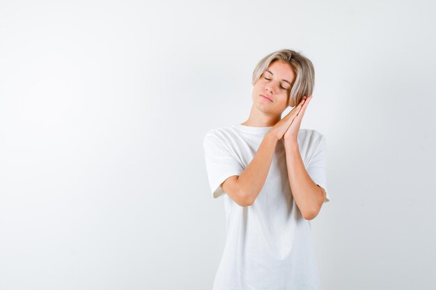 Handsome teen boy in a white t-shirt