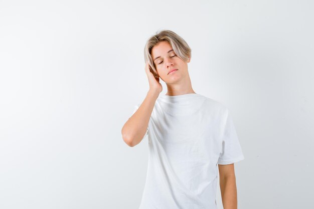 Handsome teen boy in a white t-shirt