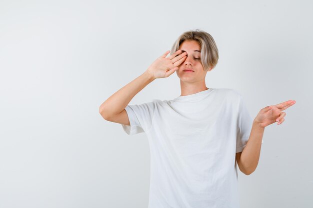 Handsome teen boy in a white t-shirt