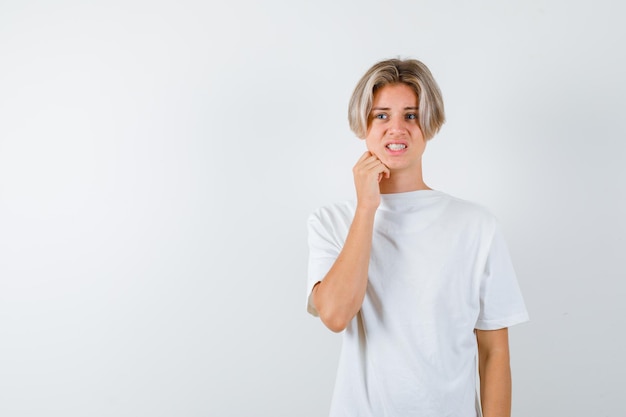 Handsome teen boy in a white t-shirt