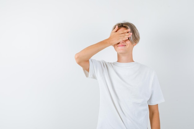 Handsome teen boy in a white t-shirt