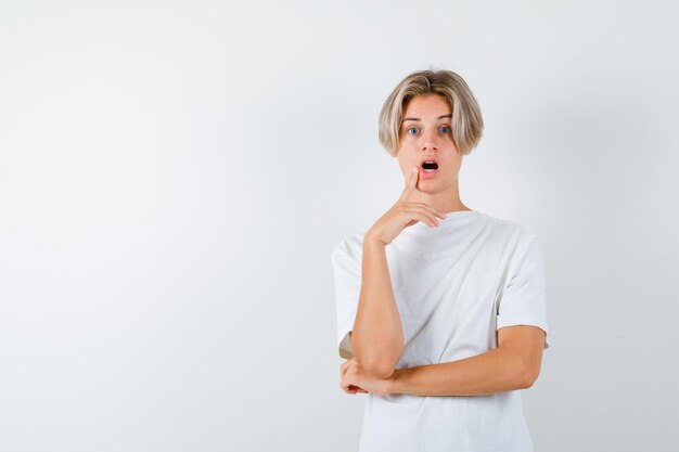 Handsome teen boy in a white t-shirt