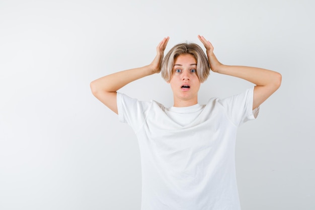 Handsome teen boy in a white t-shirt