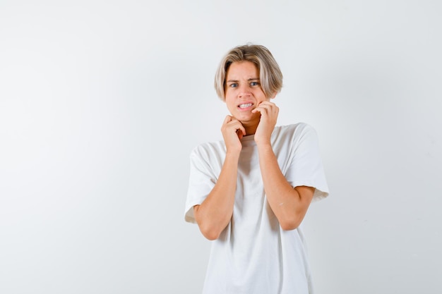 Handsome teen boy in a white t-shirt