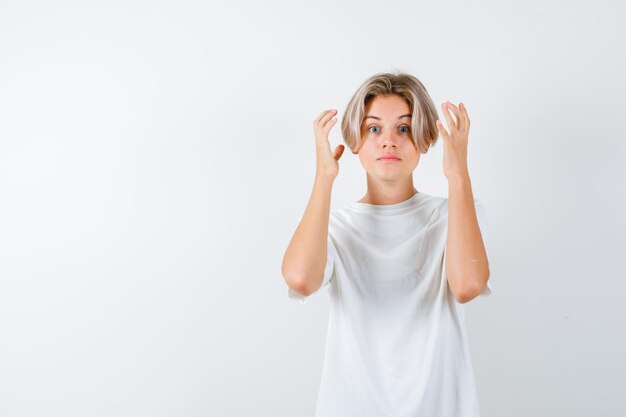 Handsome teen boy in a white t-shirt