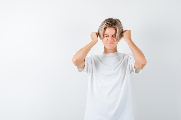 Handsome teen boy in a white t-shirt