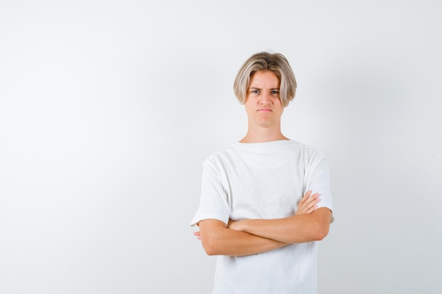 Handsome teen boy in a white t-shirt
