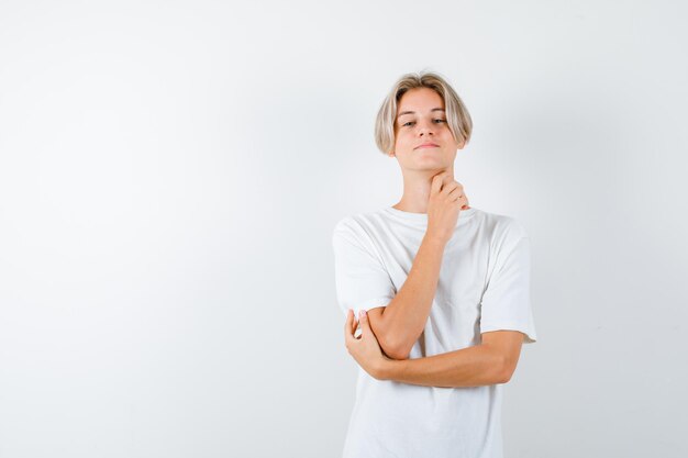 Handsome teen boy in a white t-shirt