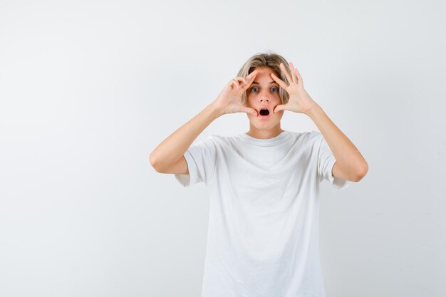 Handsome teen boy in a white t-shirt