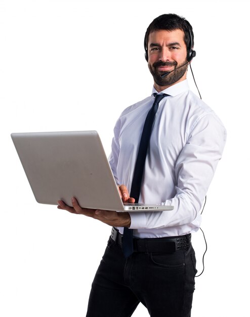 Handsome telemarketer man with laptop
