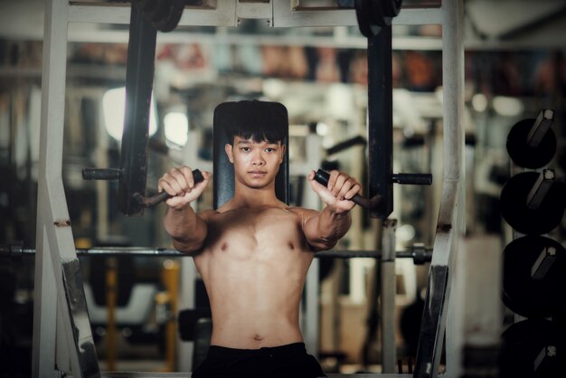 Handsome training equipment at sport gym