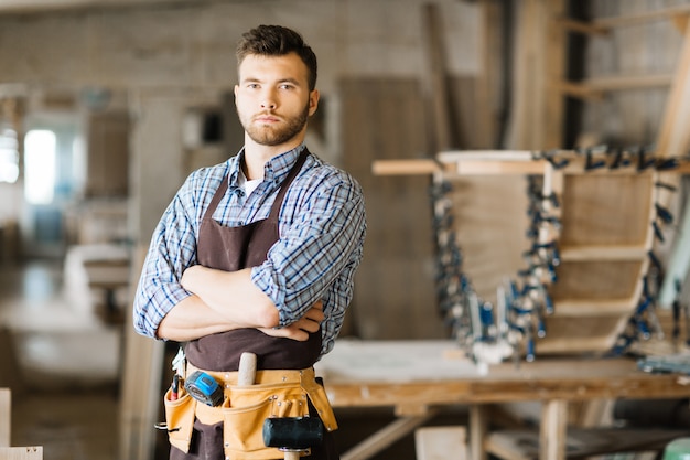 Handsome woodworker posing for photography