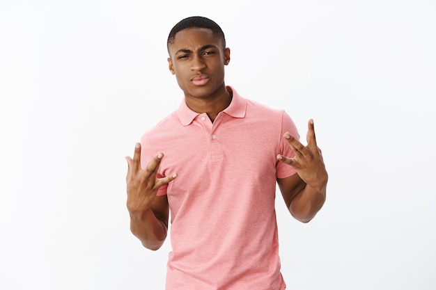 Handsome young African-American with pink polo Tshirt