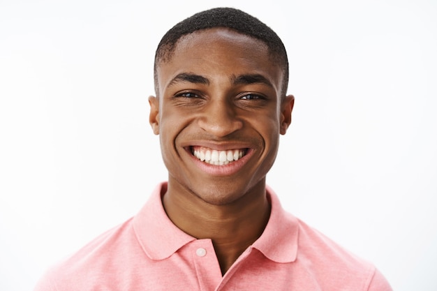 Free photo handsome young african-american with pink polo tshirt