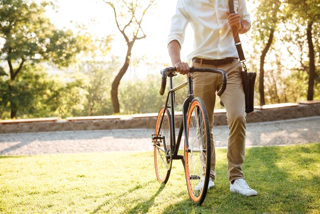 Handsome young african man early morning with bicycle