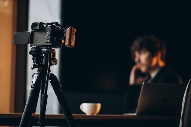 Handsome young blogger at a recording station