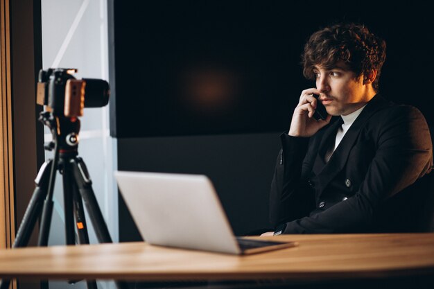 Handsome young blogger at a recording station