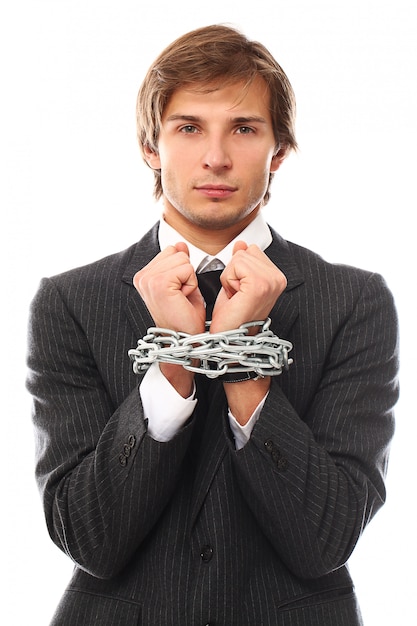 Handsome young businessman portrait chained