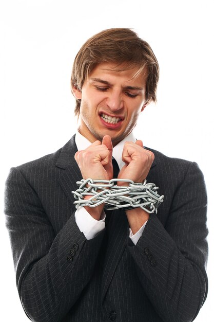 Handsome young businessman portrait chained