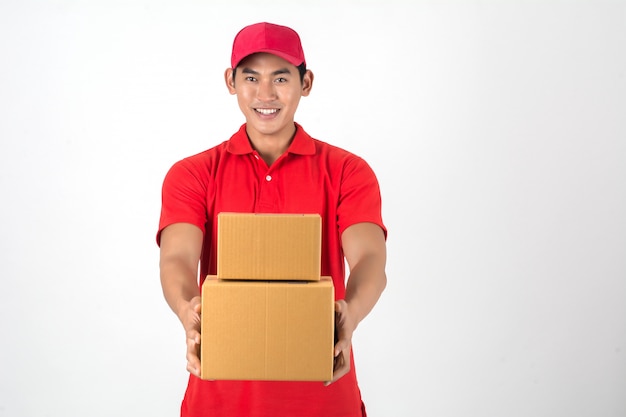 Handsome young delivery man with box isolated on white background.