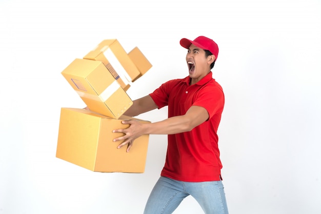 Handsome young delivery man with box isolated on white background.