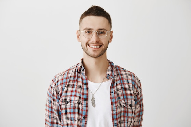 Free photo handsome young guy with glasses posing