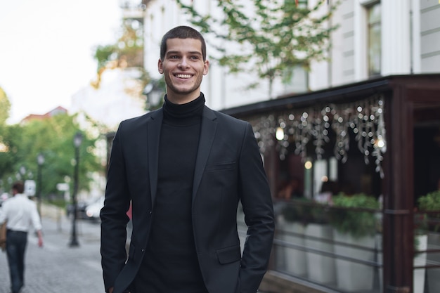 Handsome young male walking on the street